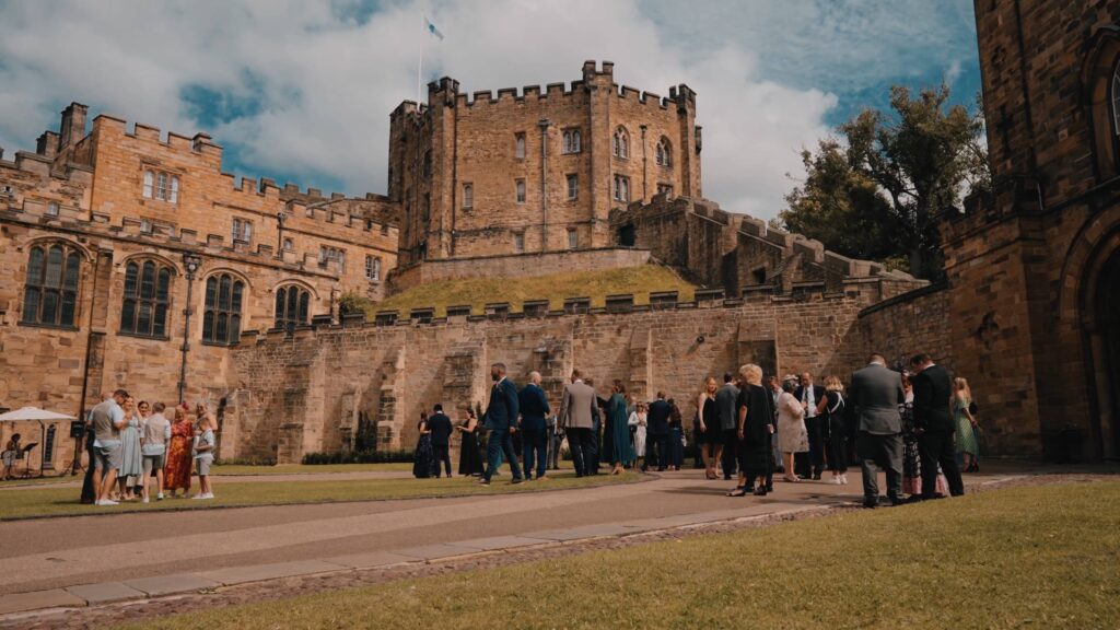 Durham castle reception drinks by Durham castle wedding videographer