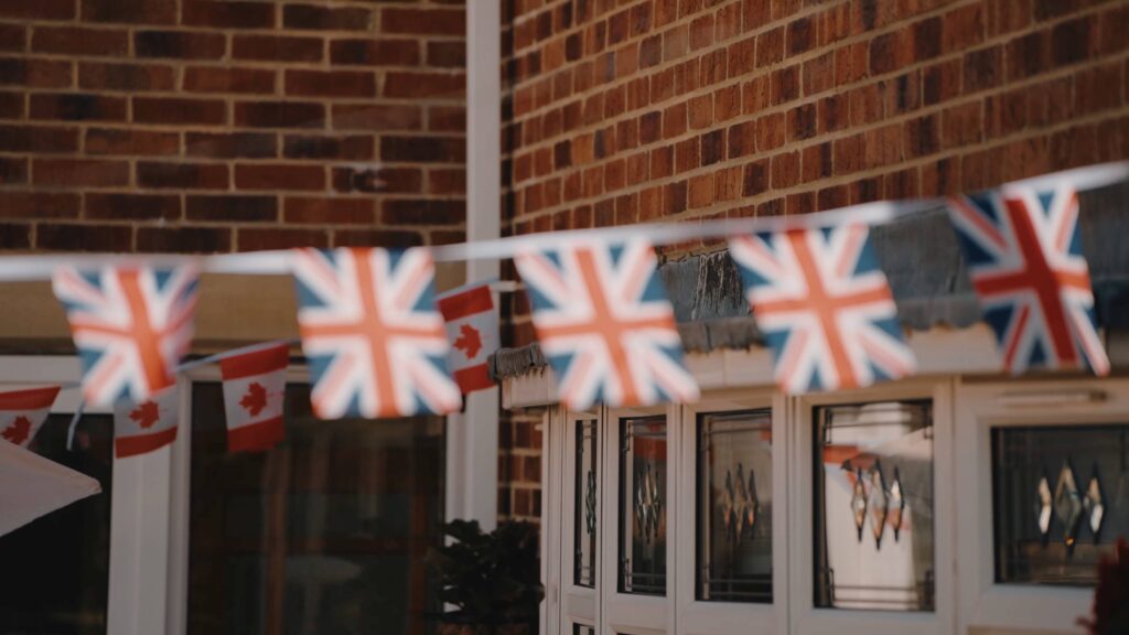 Canads and UK flags shot by Durham castle wedding videographer